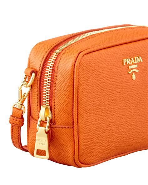 orange prada crossbody bag.